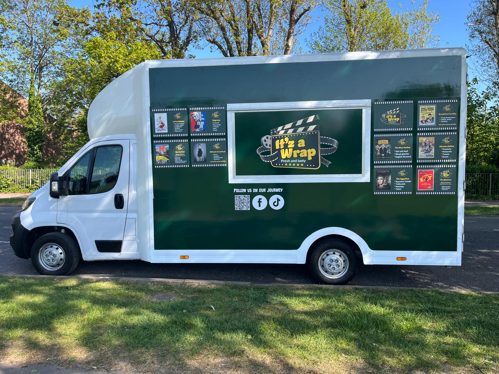 The It'z a Wrap food truck serving freshly prepared wraps at a busy marketplace